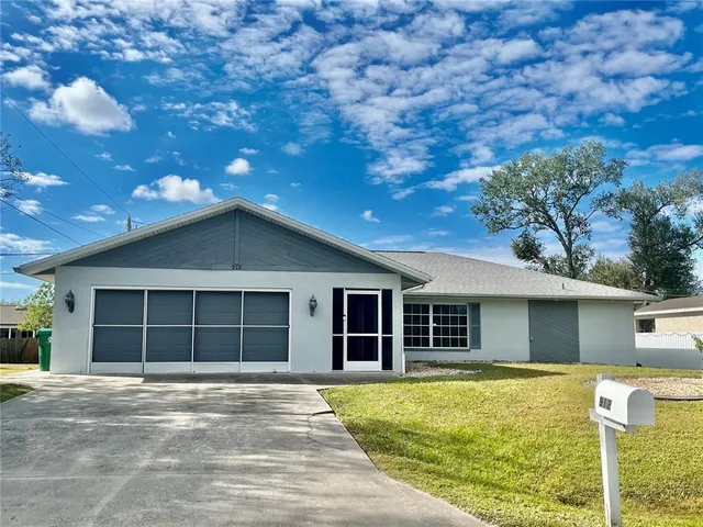 a house with trees in the background