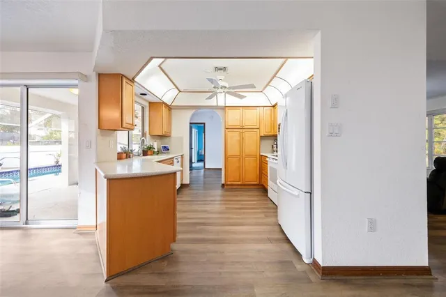 a view of living room with furniture and wooden floor