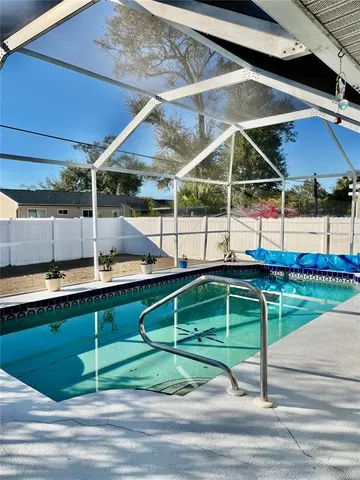 a backyard of a house with large trees