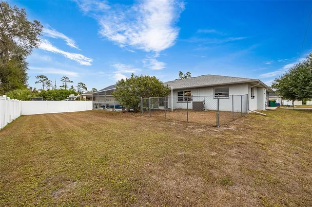 an aerial view of residential houses with city view