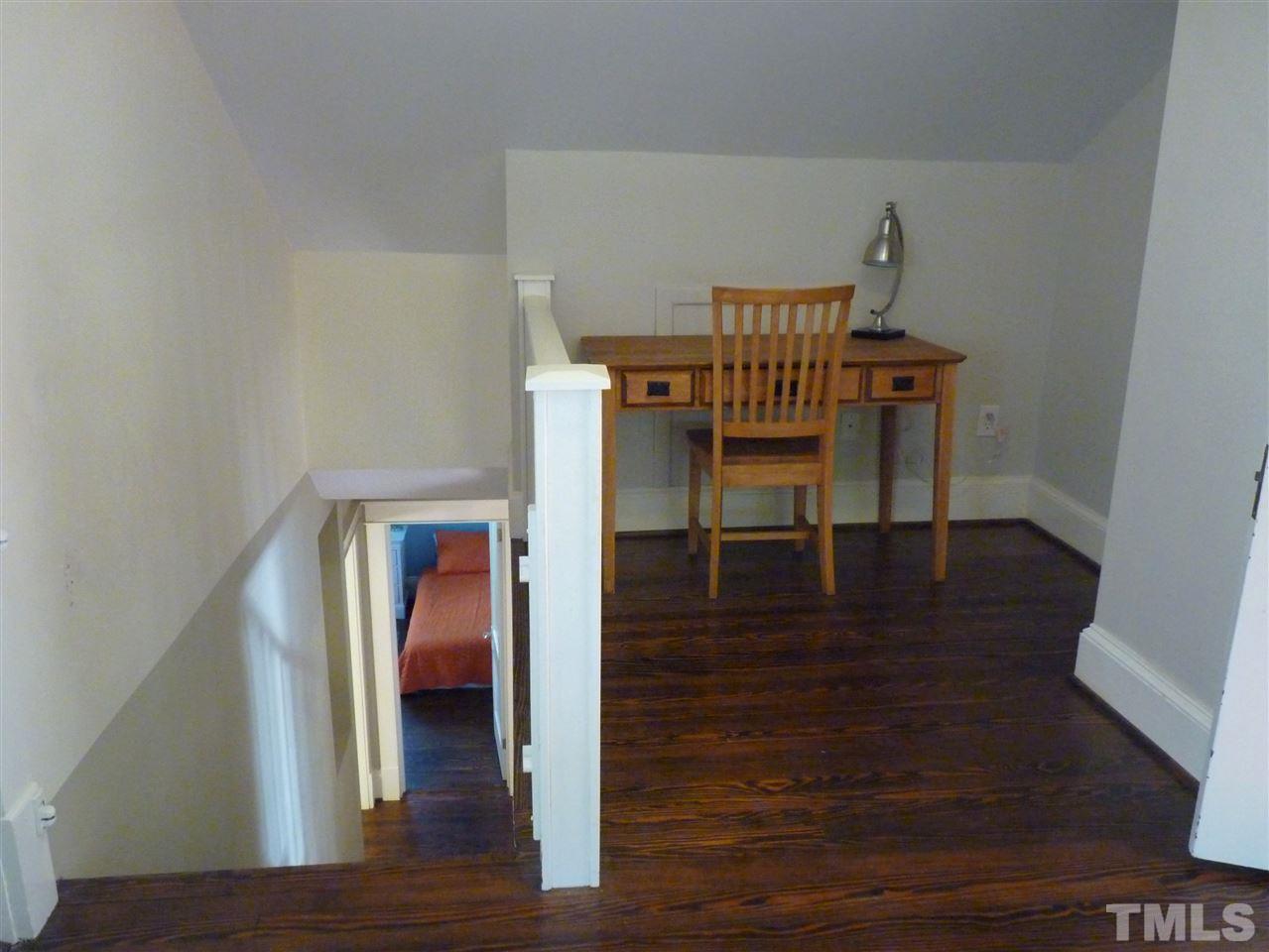807 West South Street Raleigh, NC 27603 - Photo 18 of 30 Upstairs master area features a nice office nook as well as a seating area and cedar storage bench