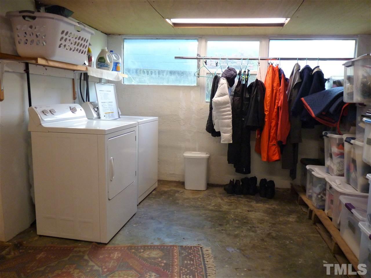 807 West South Street Raleigh, NC 27603 - Photo 22 of 30 Plenty of storage in the laundry room. This area (as well as the adjacent storage) is not included in the living area square footage due to ceiling height.