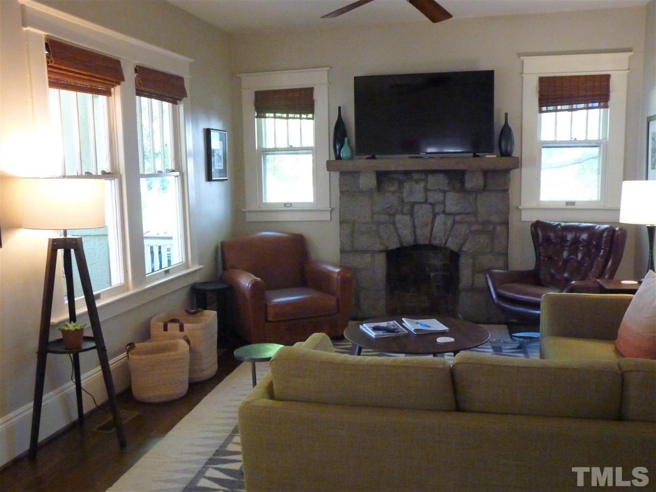807 West South Street Raleigh, NC 27603 - Photo 5 of 30 Fireplace is decorative but makes a great focal point for the room.