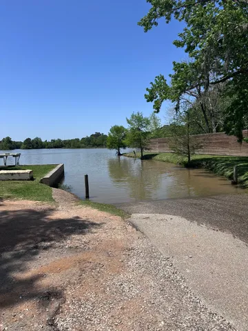 a view of a lake with houses in the background