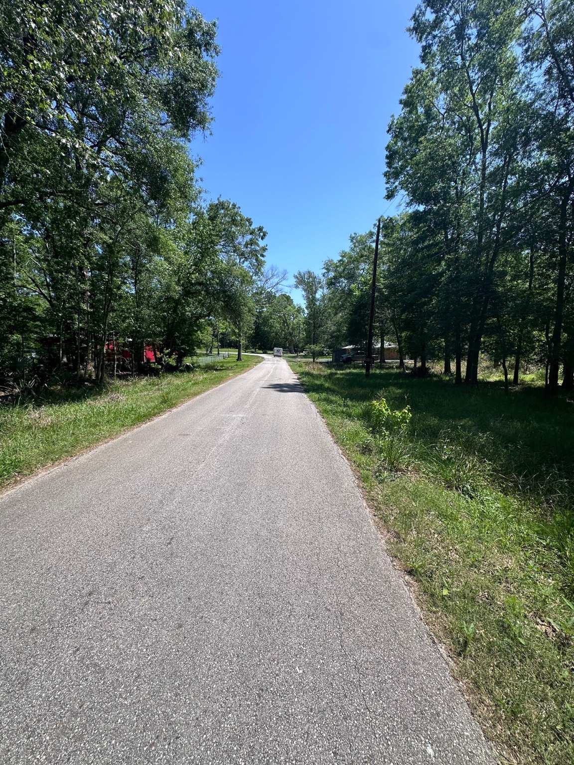 0 Pin Oak Drive Huffman, TX 77336 - Photo 6 of 6 a view of a road with a yard