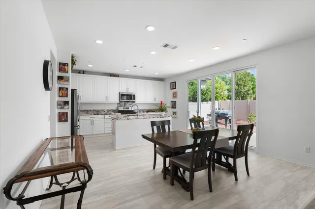 a view of a dining room with furniture window and outside view