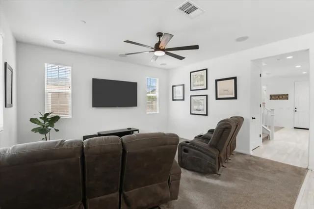 a kitchen with stainless steel appliances granite countertop a stove refrigerator sink and microwave