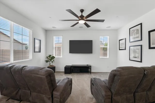 a kitchen with granite countertop a sink stove and refrigerator