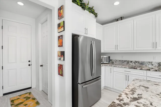 a bedroom with a bed and a television