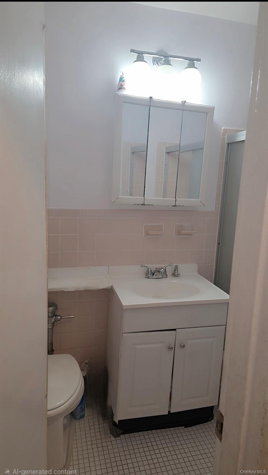 151-15 84th Street, Unit 6D Queens, NY 11414 - Photo 4 of 4 a utility room with a sink washer and dryer