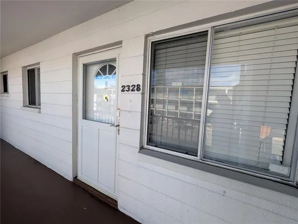 a view of a door and a window
