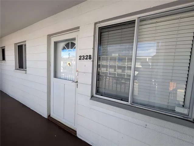 a view of a door and a window