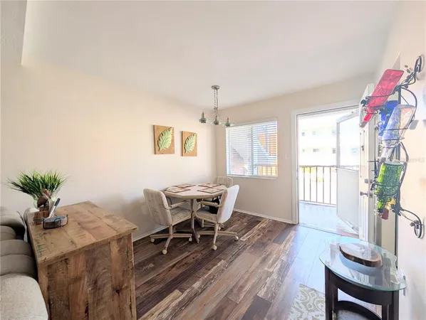 a view of a livingroom with furniture window and wooden floor