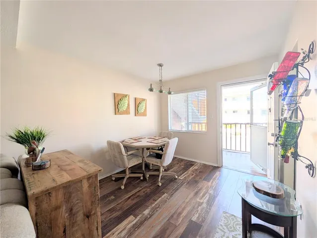 a view of a livingroom with furniture window and wooden floor