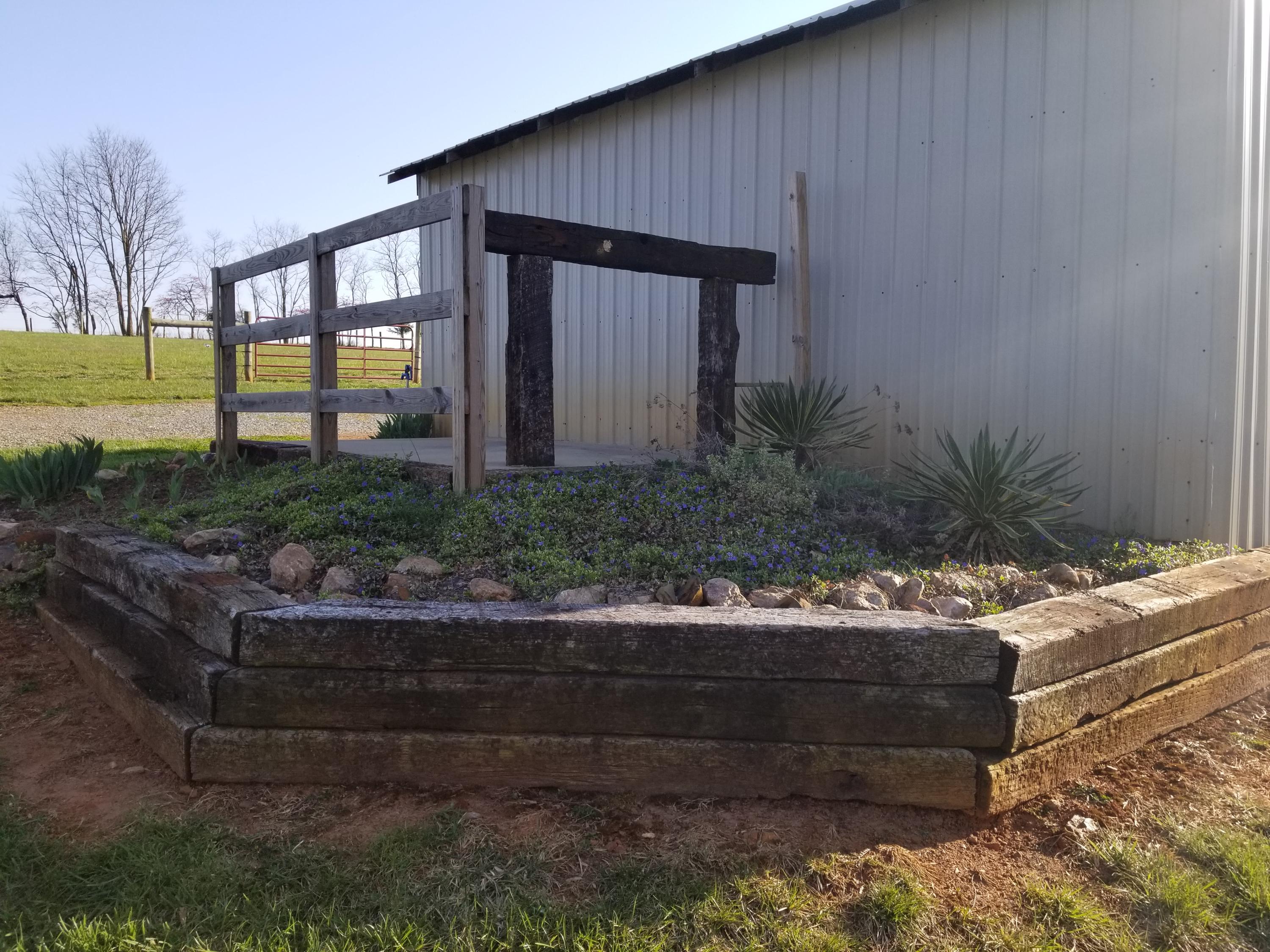 3218 Ayers Road Moneta, VA 24121 - Photo 17 of 67 a wooden bench sitting in front of a building
