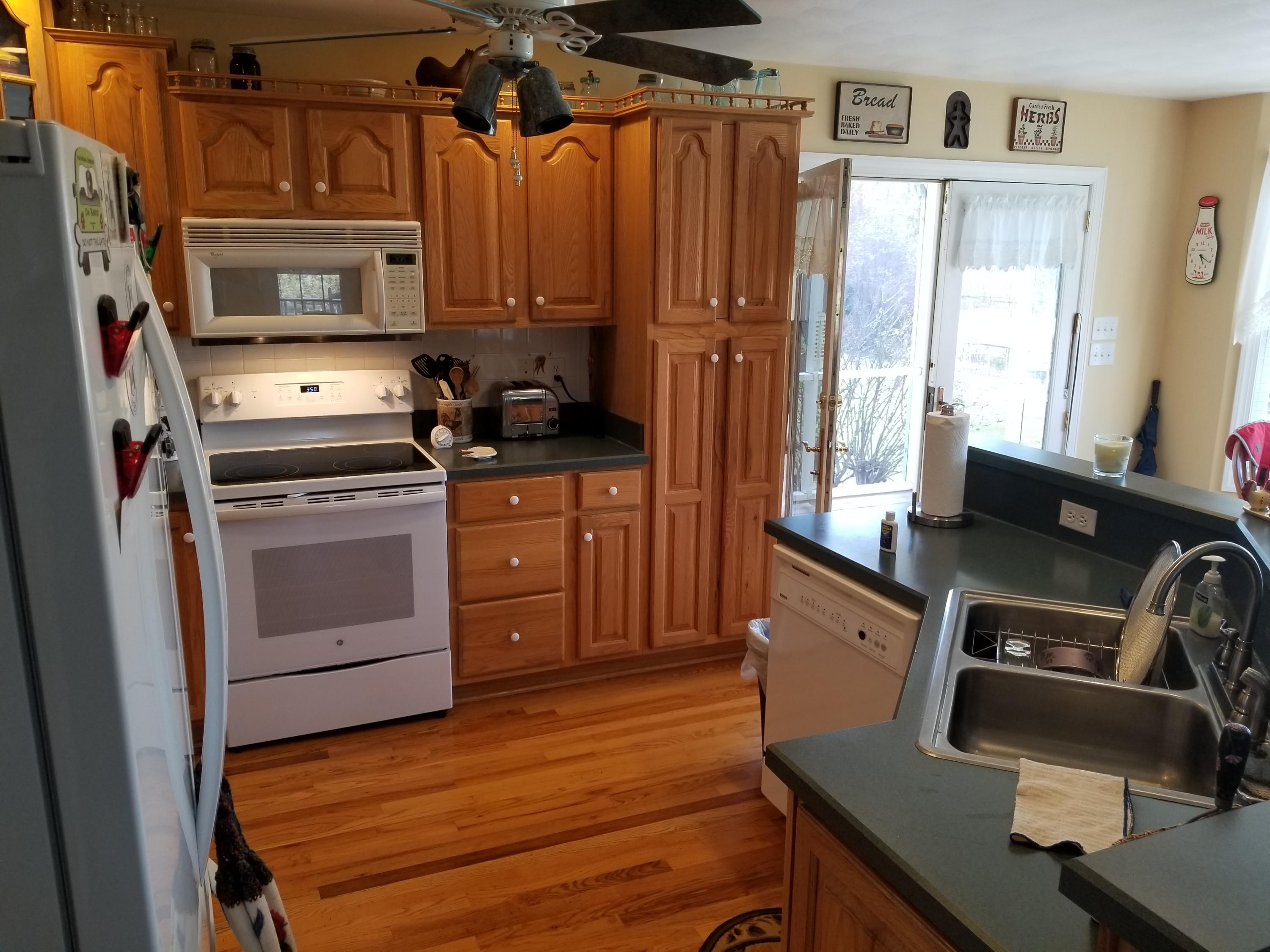 3218 Ayers Road Moneta, VA 24121 - Photo 23 of 67 a kitchen with a stove a refrigerator and a stove top oven