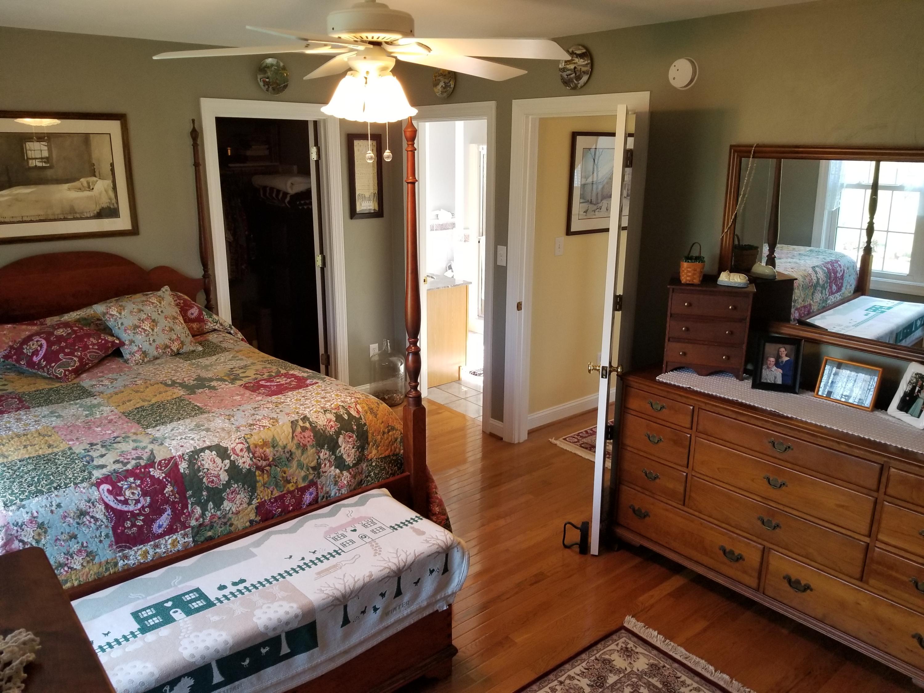3218 Ayers Road Moneta, VA 24121 - Photo 31 of 67 a bedroom with a bed and wooden floor