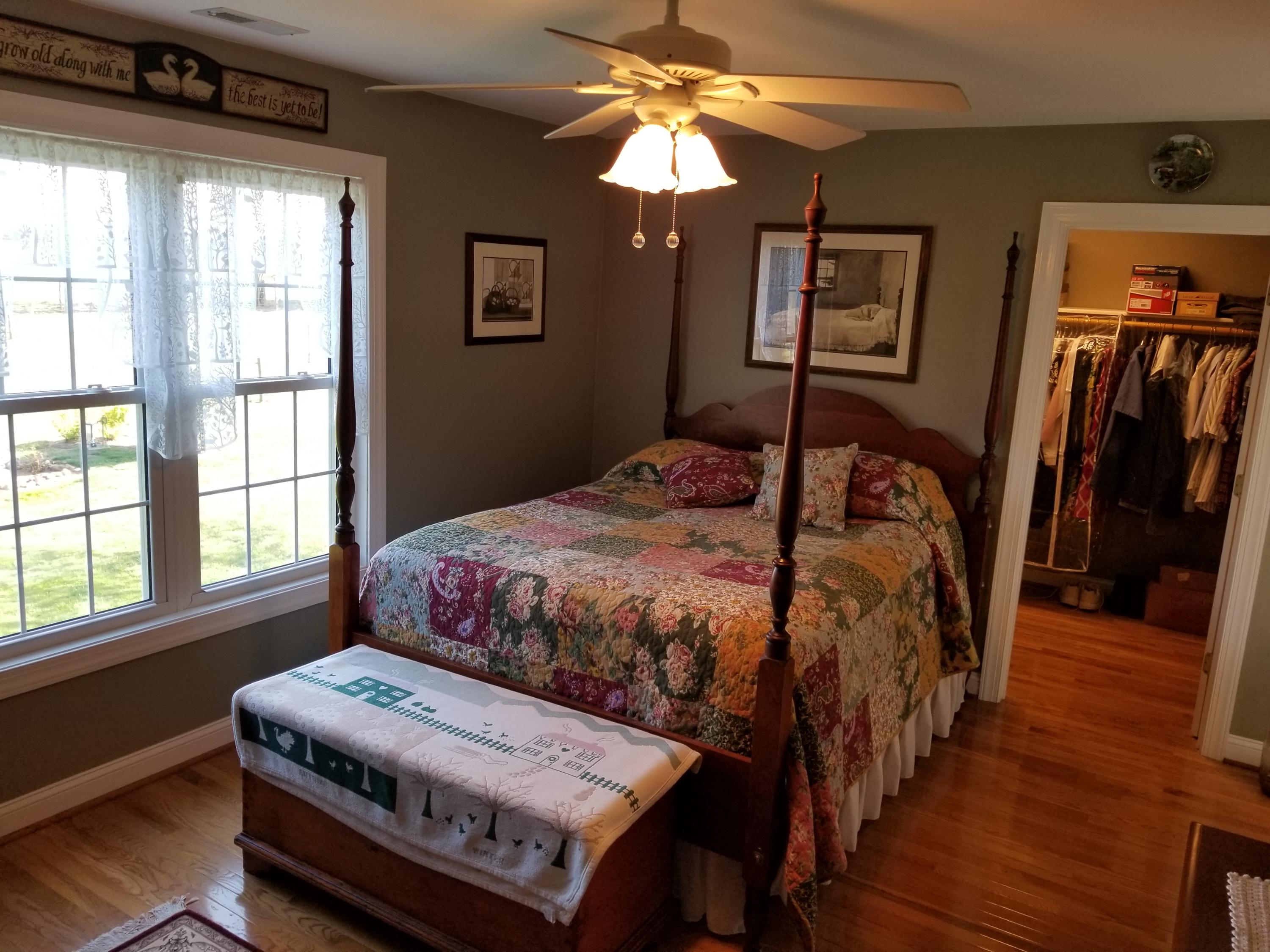 3218 Ayers Road Moneta, VA 24121 - Photo 32 of 67 a bedroom with a bed a window and dresser
