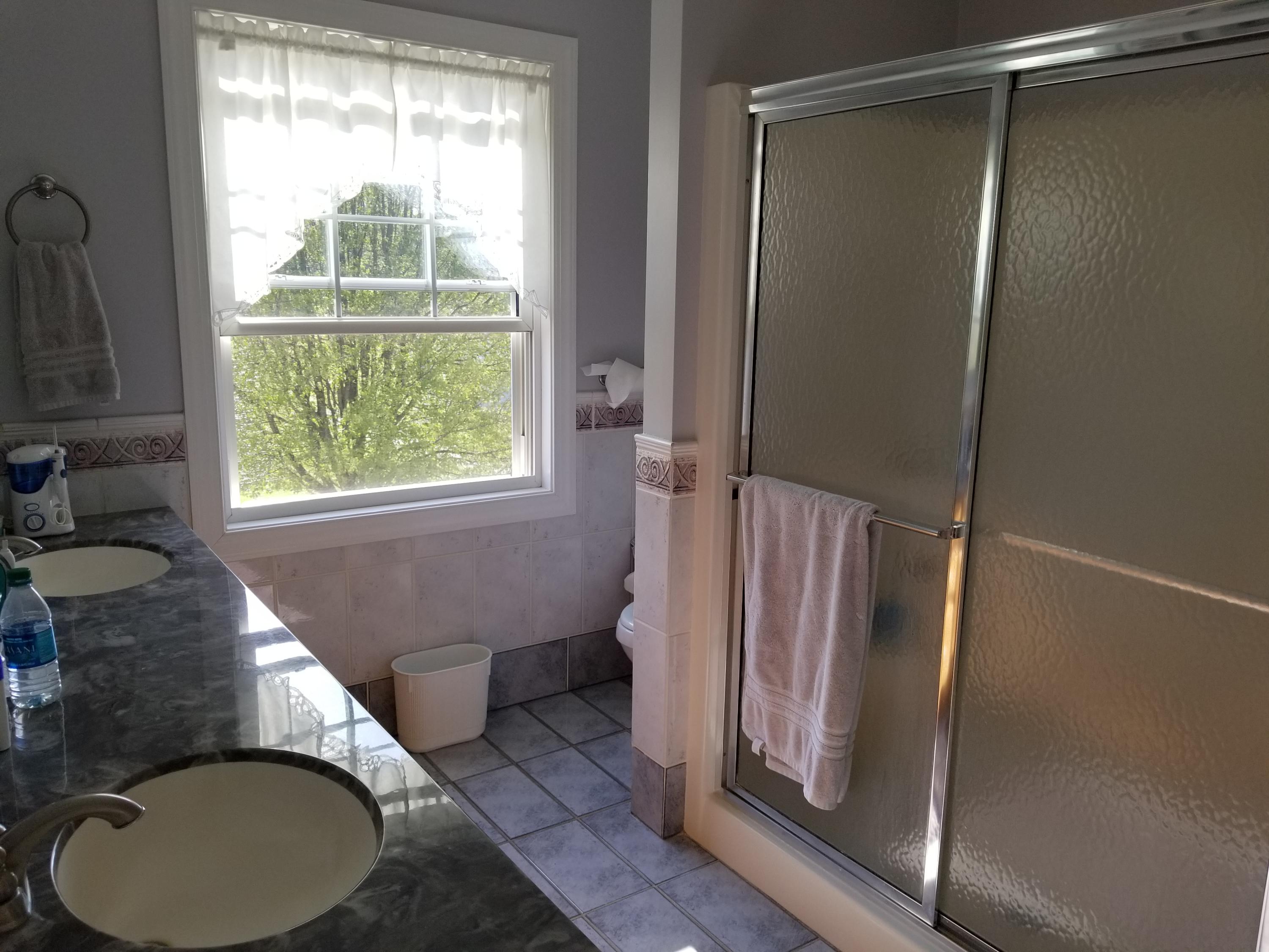 3218 Ayers Road Moneta, VA 24121 - Photo 35 of 67 a bathroom with a sink toilet and a mirror
