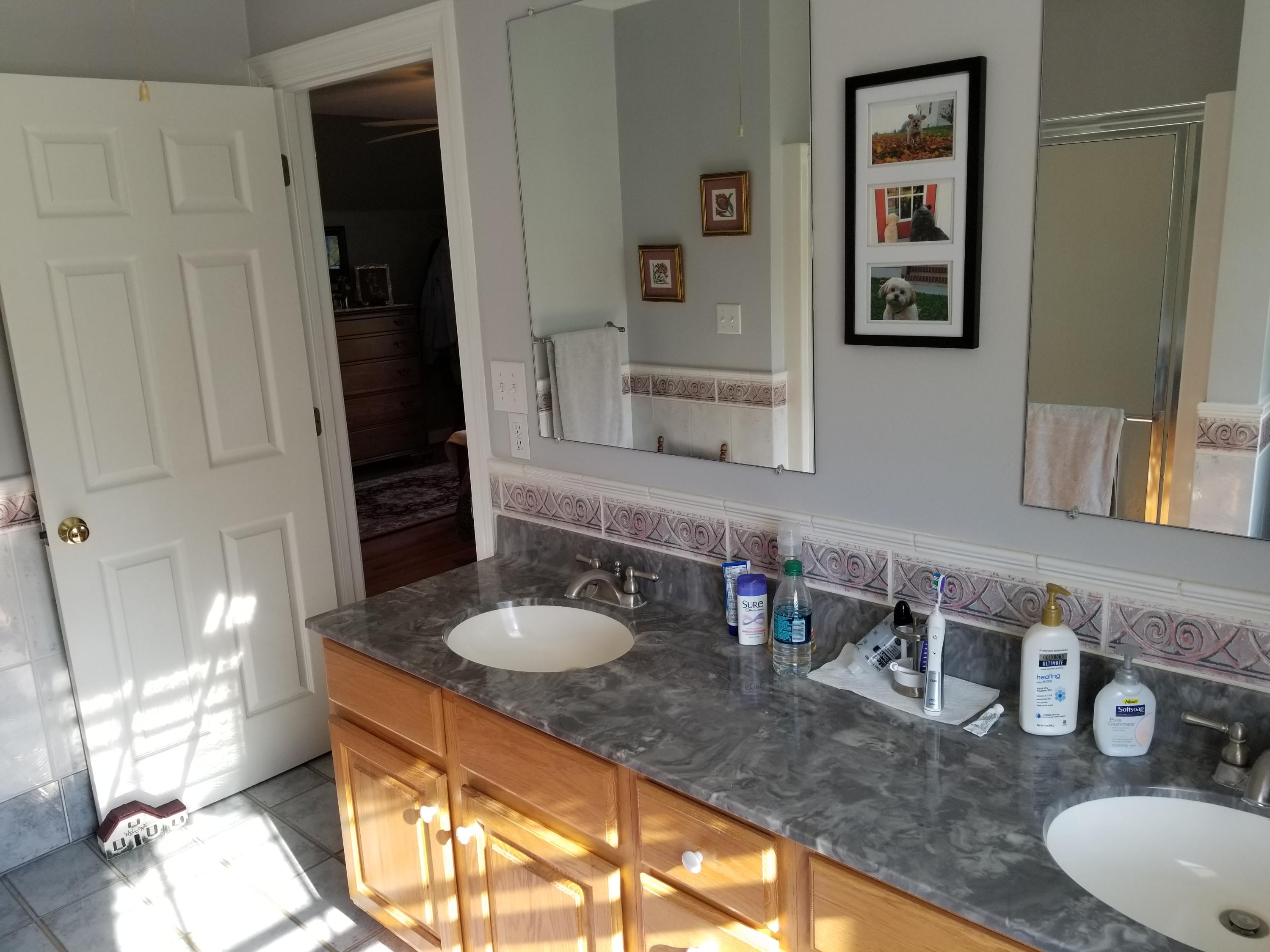 3218 Ayers Road Moneta, VA 24121 - Photo 36 of 67 a bathroom with a granite countertop sink and a mirror