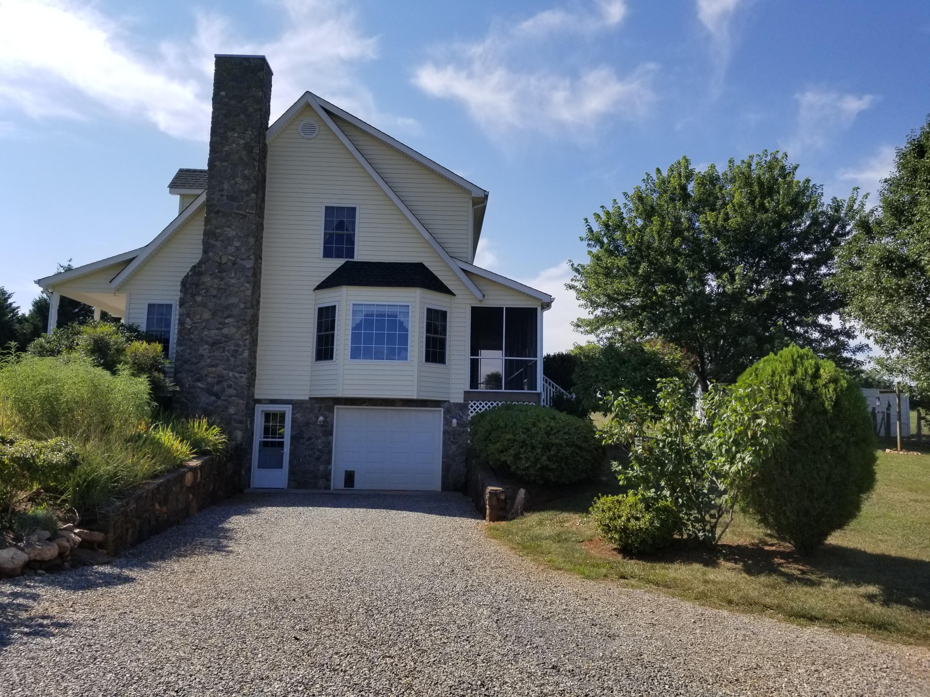 3218 Ayers Road Moneta, VA 24121 - Photo 7 of 67 a front view of a house with a garden