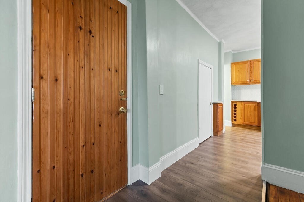 16 Mount Hood Terrace, Unit 2 Lynn, MA 01902 - Photo 12 of 28 a view of a hallway with wooden floor