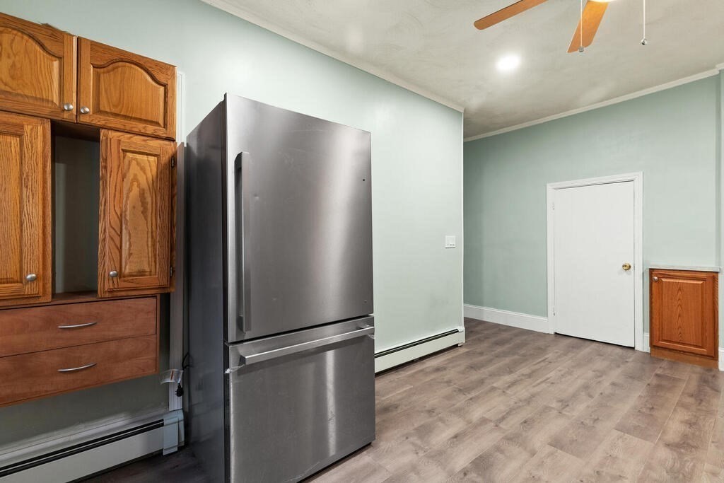 16 Mount Hood Terrace, Unit 2 Lynn, MA 01902 - Photo 18 of 28 a view of a refrigerator in kitchen and an empty room
