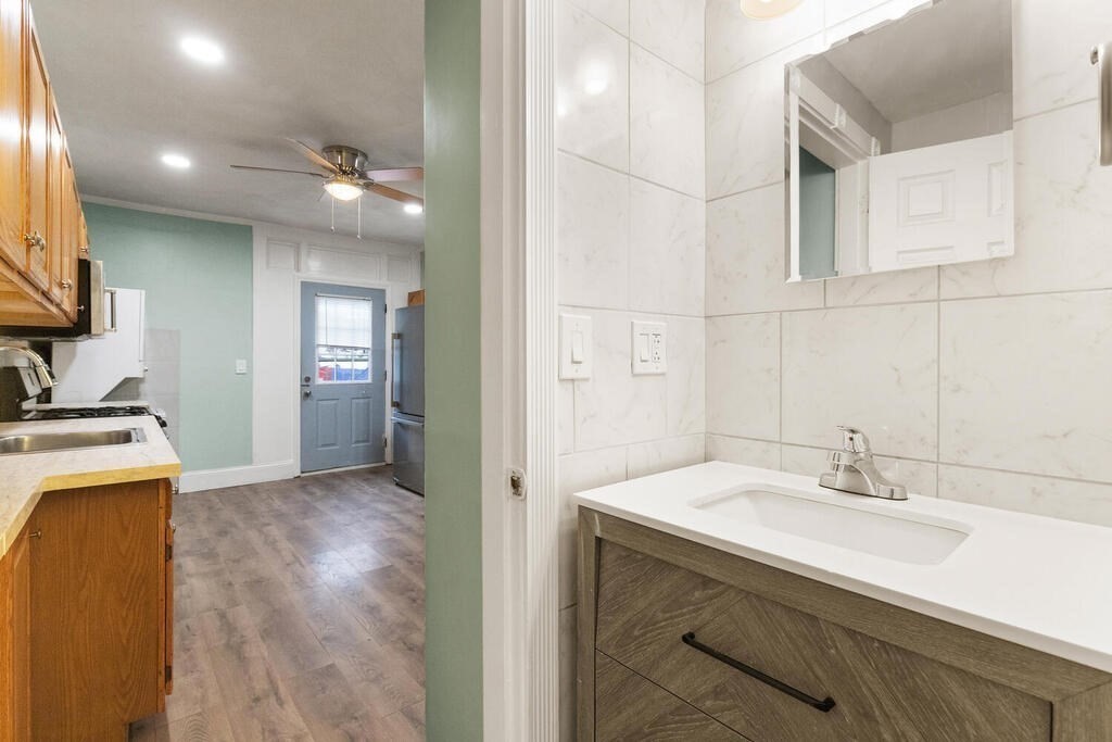 16 Mount Hood Terrace, Unit 2 Lynn, MA 01902 - Photo 22 of 28 a bathroom with a sink double vanity and a mirror