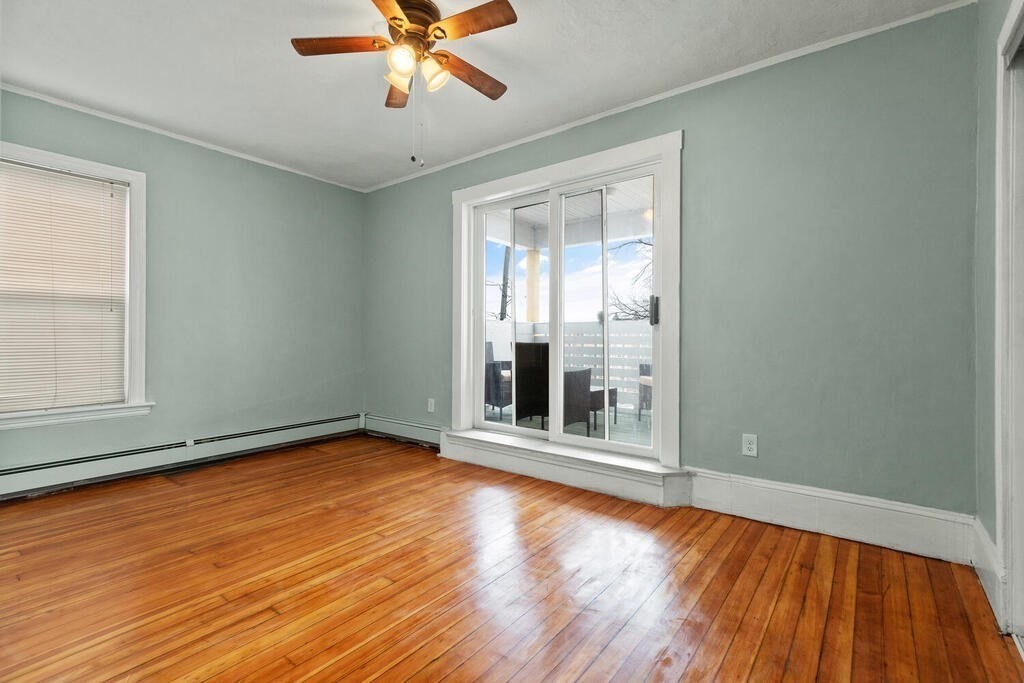 16 Mount Hood Terrace, Unit 2 Lynn, MA 01902 - Photo 3 of 28 wooden floor in an empty room with a window