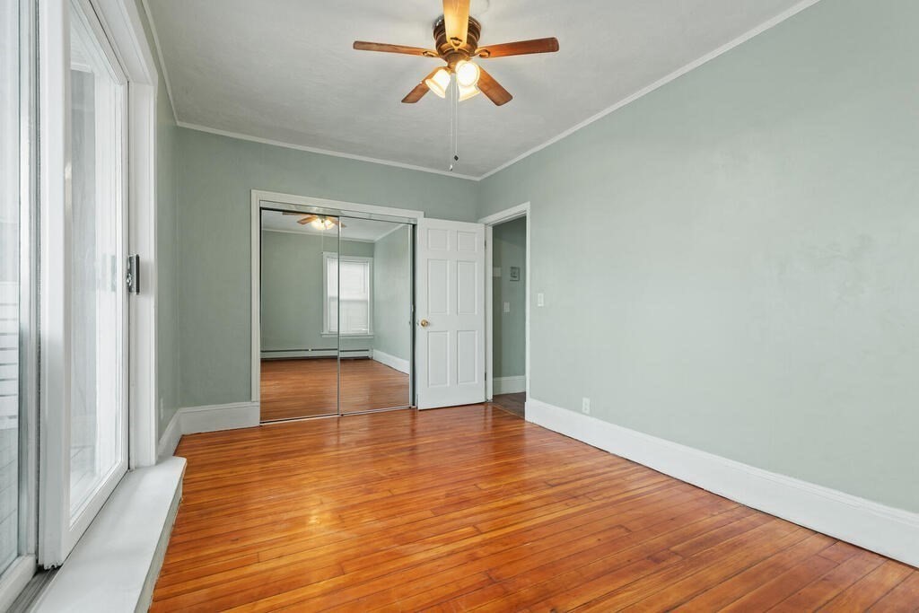 16 Mount Hood Terrace, Unit 2 Lynn, MA 01902 - Photo 4 of 28 a view of empty room with wooden floor and fan