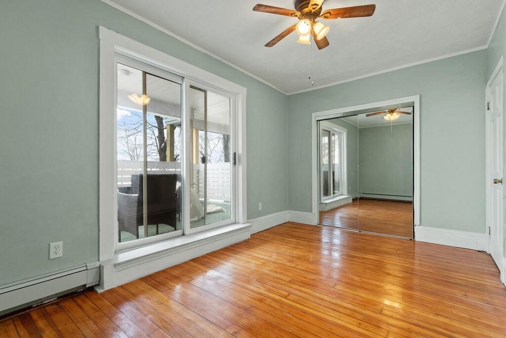 16 Mount Hood Terrace, Unit 2 Lynn, MA 01902 - Photo 5 of 28 wooden floor in an empty room with a window