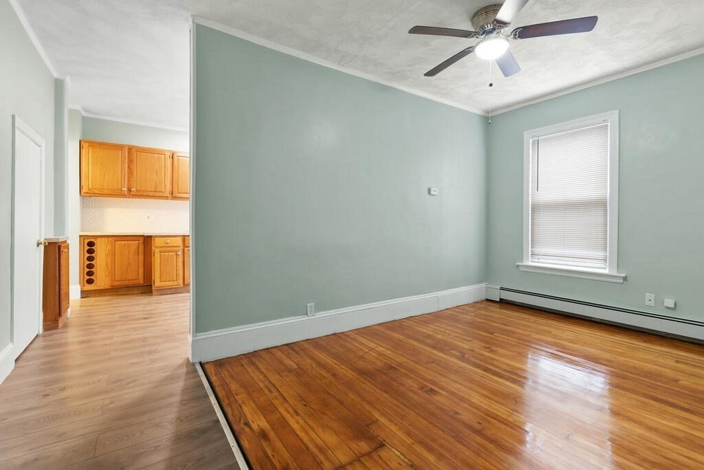 16 Mount Hood Terrace, Unit 2 Lynn, MA 01902 - Photo 7 of 28 wooden floor in an empty room with a window