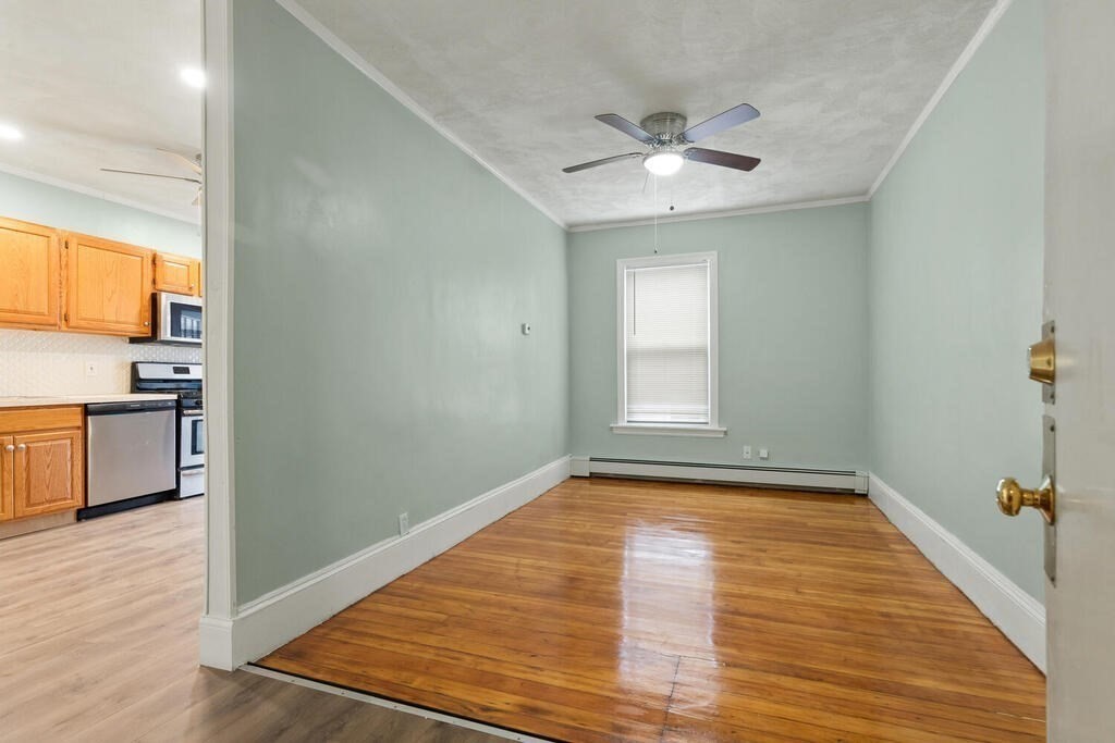 16 Mount Hood Terrace, Unit 2 Lynn, MA 01902 - Photo 8 of 28 a view of a room with wooden floor and kitchen