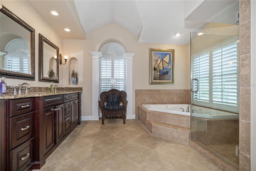 3372 Brian Road South Palm Harbor, FL 34685 - Photo 21 of 45 a spacious bathroom with a tub sink and mirror