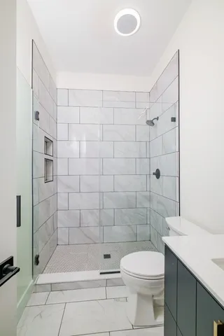 a bathroom with a bathtub and shower