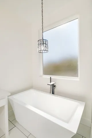 a view of an empty room and a window