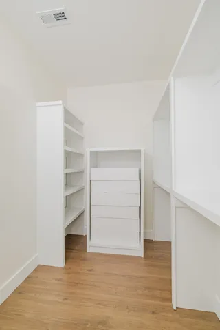an aerial view of a house with a garden and lake view