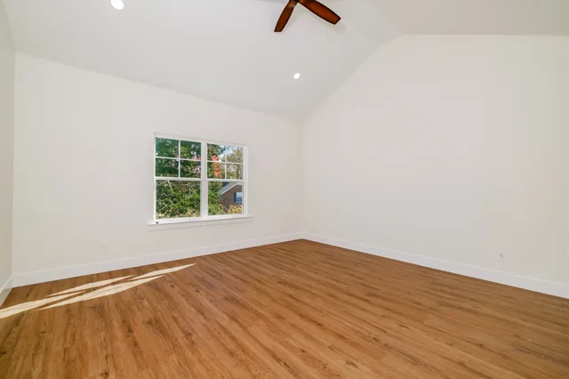 an aerial view of residential houses with outdoor space and river view
