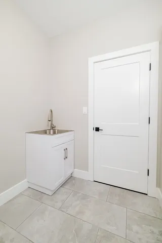 a view of a lake with a yard and outdoor seating