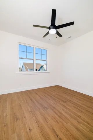 a view of a patio with a table and chairs under an umbrella