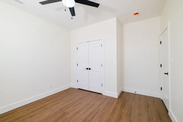 a swimming pool with outdoor seating and plants