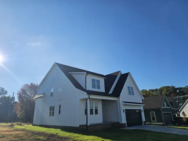 a swimming pool with large glass windows and painted walls