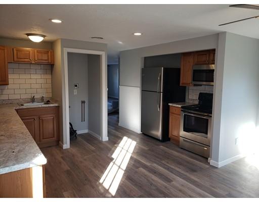 194 Nottingham Street Springfield, MA 01104 - Photo 4 of 13 a kitchen with granite countertop a refrigerator and a sink