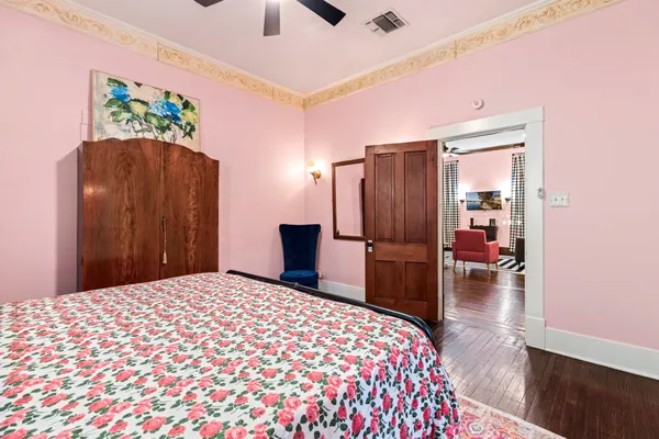 a bedroom with a large bed and a large closet