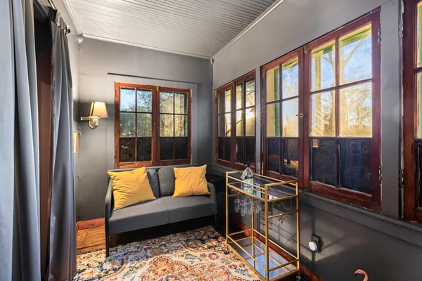 a bedroom with furniture and a window