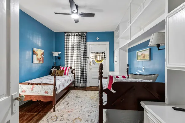 a bedroom with bed and a window