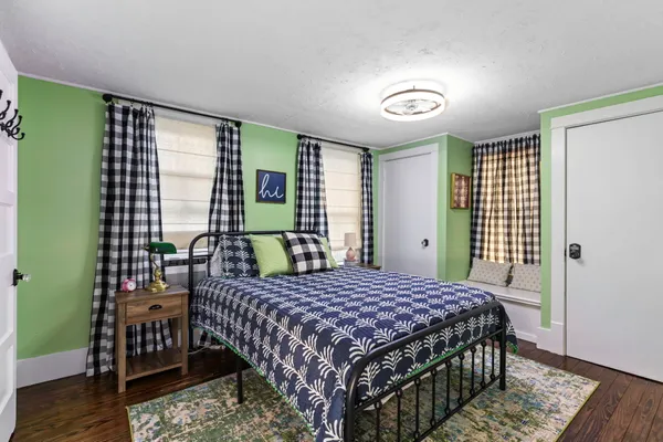 a bedroom with a bed and a table in it