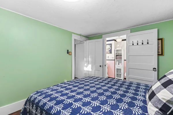 a bedroom with a bed and a cabinets