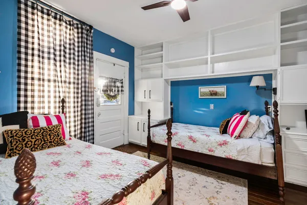a bedroom with a bed and dresser