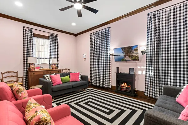a living room with furniture and a fireplace